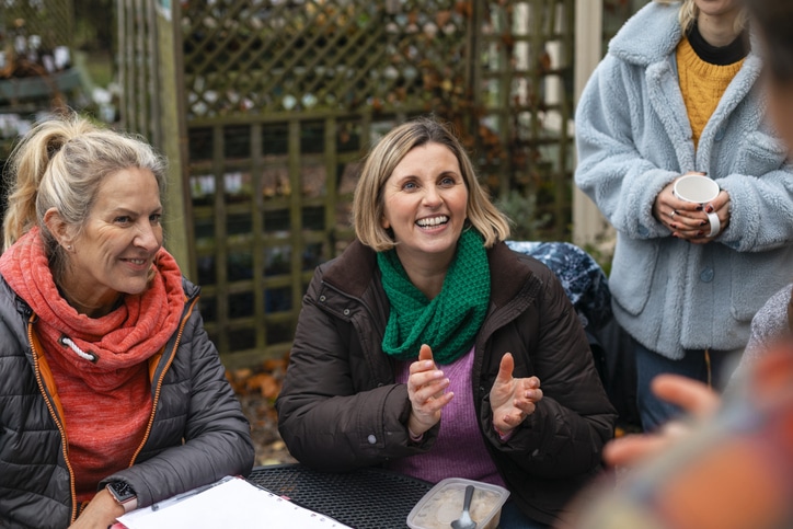 Charity copywriter represented by a group of charity volunteers