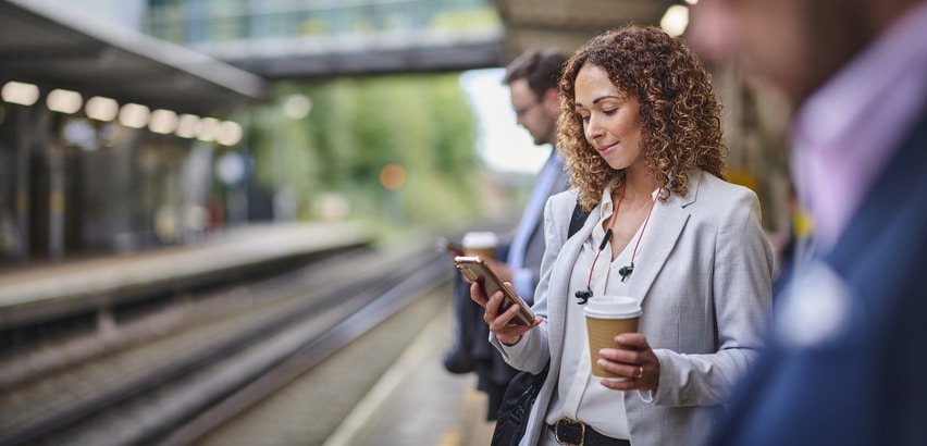 Social media marketing signified by a woman using a phone