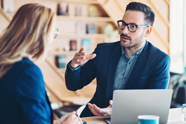 LinkedIn marketing represented by two workers chatting