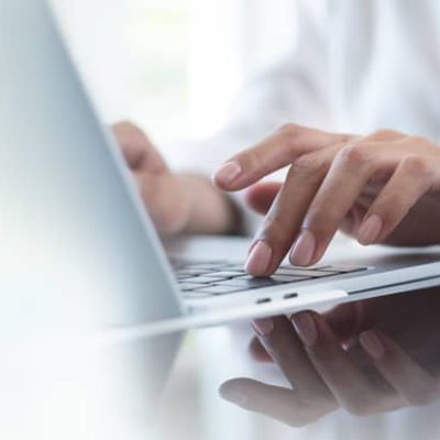 Website copy review represented by a laptop and mobile